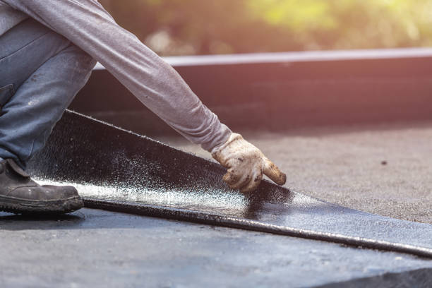 Professional Waterproofing technician working in Garden City, NY
